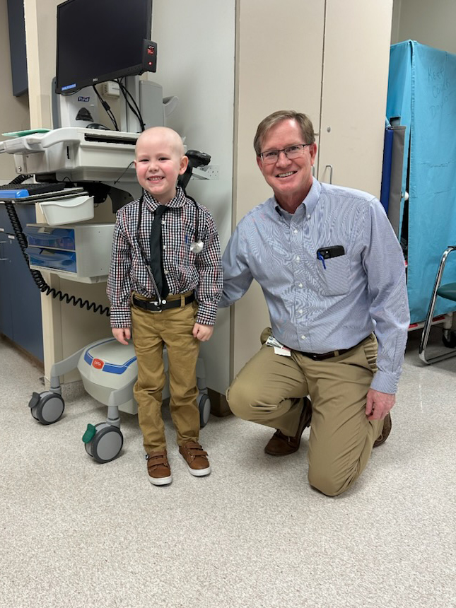 Dr. Greg Brandt with Cal on dress like your father day.