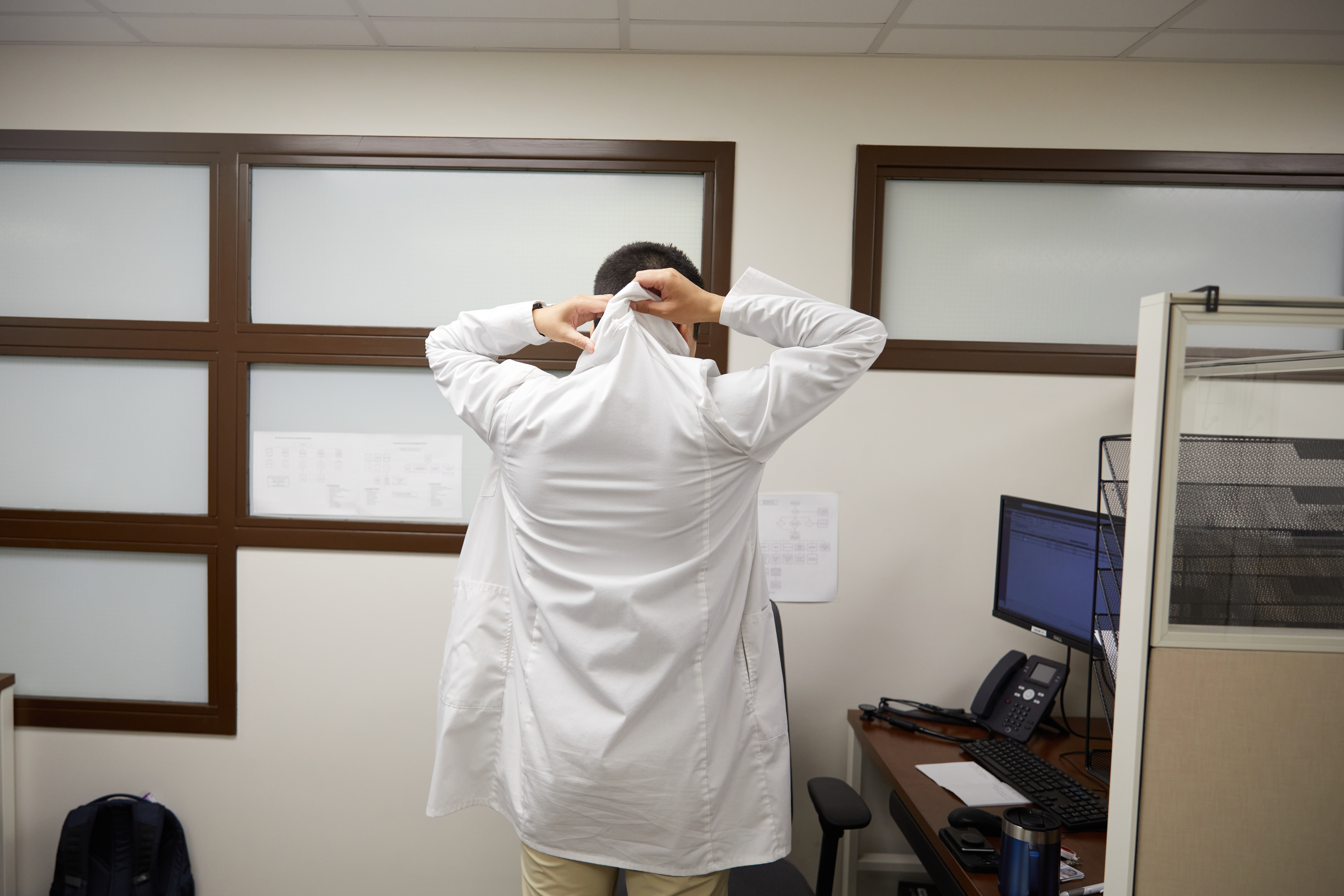 Dr. Julio Mendoza Estrada puts on his white coat