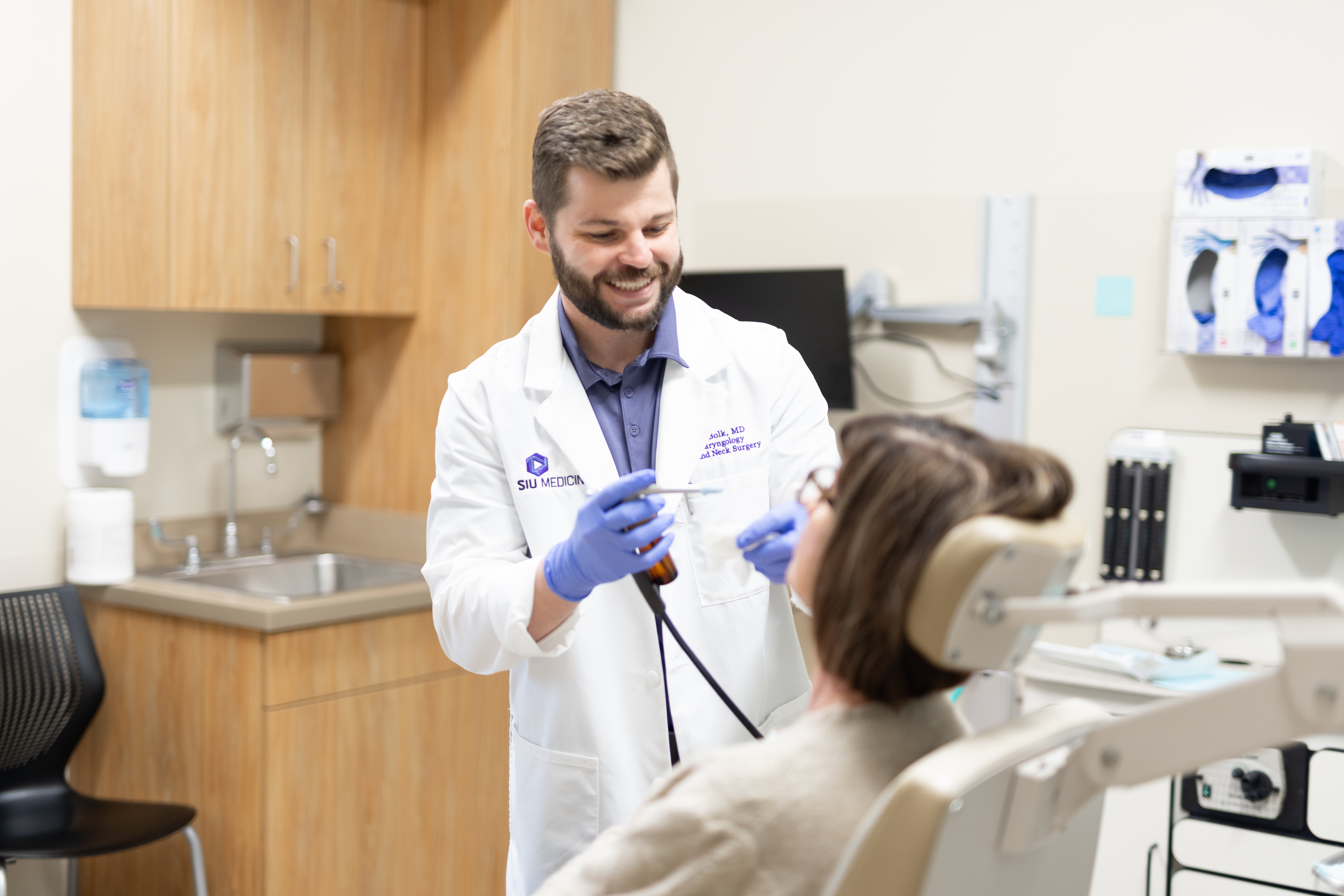 Dr. Kody bolk working with patient