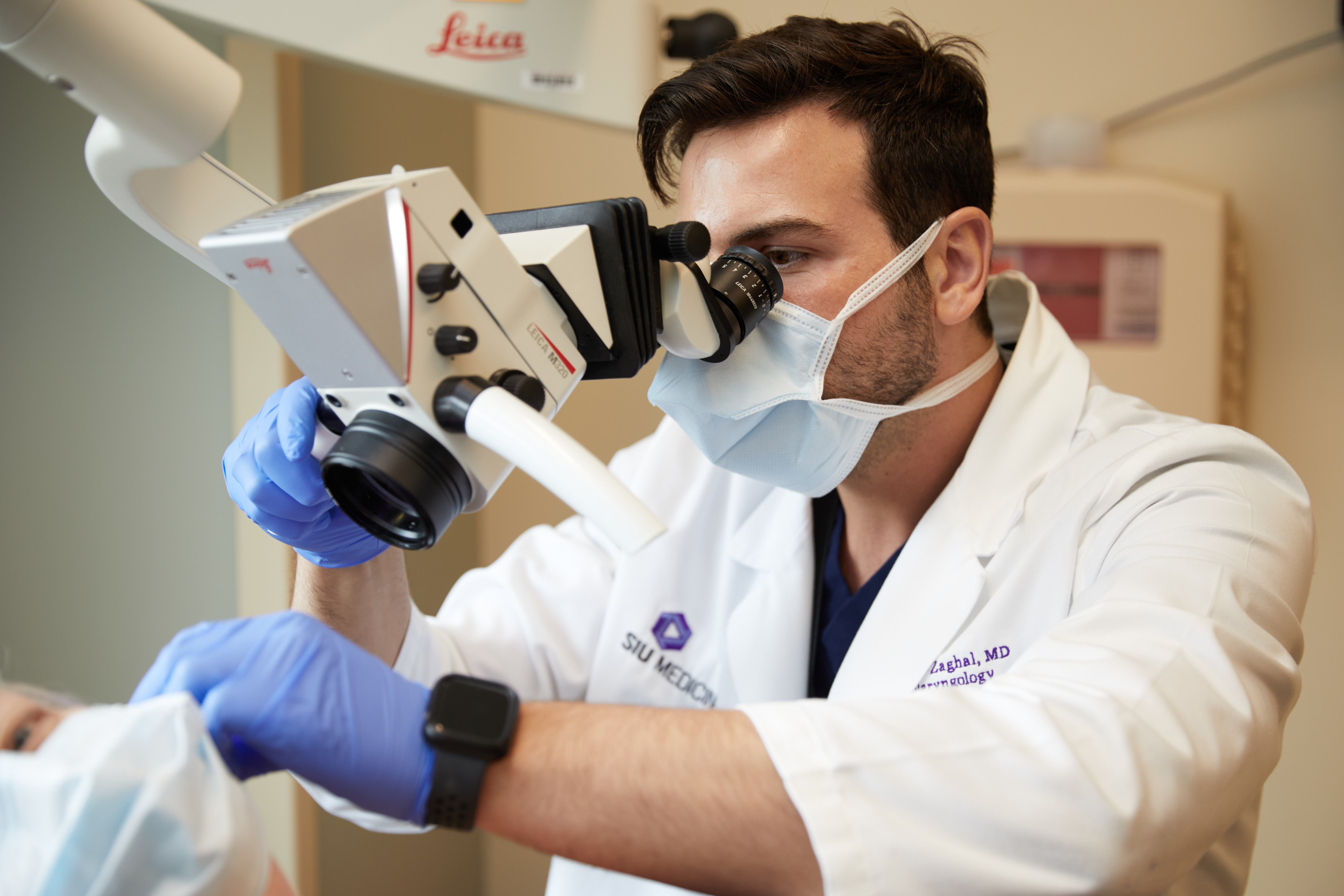 Dr. Al-Zaghal examining a patient
