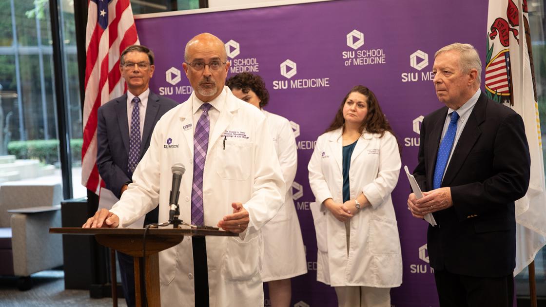 Don Torry speaking at podium 