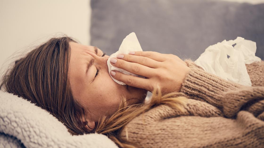 sniffle nose cold flu person