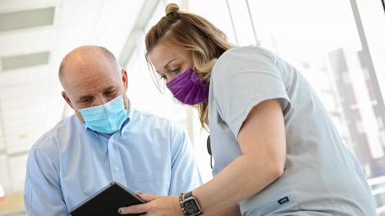 Nurse review a chart with her patient