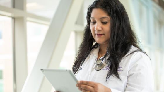 Doctor looks at chart photo