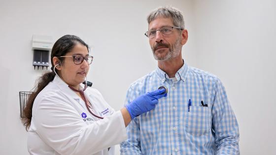 Nurse checking a patients heartbeat