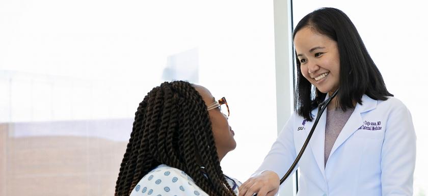 doctor with female patient pulse